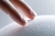 © Kordiush - extreme macro of smooth ceramic surface being touched by fingertips, subtle skin texture contrast, minimalistic composition, soft studio lighting, tactile elegance, modern aesthetic