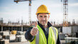 © Aalami - A construction worker giving a thumbs up on a building site