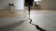 © ModernFiles - Precision inspection tool positioned to assess insect risk along interior floor cracks