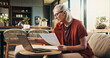 © OnPoint/peopleimages.com - Documents, laptop and senior woman on sofa in home planning for retirement fund with savings. Paperwork, computer and elderly female person with finance budget for pension account in living room.