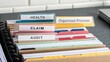 © Fais - Organized File Management System with Color-Coded Folders and Labels for Health, Claim, and Audit Documentation