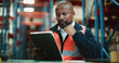 © BuyOutFelix06/peopleimages.com - Logistics, warehouse and man with tablet, thinking or inventory for supply chain, stock and shipping. Factory, mature operations manager and black person with tech for distribution and production