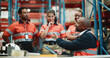 © BuyOutFelix06/peopleimages.com - Logistics, tablet and manager with people in warehouse for inspection checklist, cargo storage and freight. Supply chain inventory, distribution advisor and online report with employees in factory