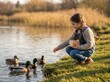 © Olivia Patric - Young girl feeding ducks by the pond during golden hour