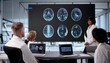 © Andrey Popov - Medical Team Examines MRI Scan In Office