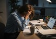 © twilight mist - Woman experiencing stress and exhaustion while working late at a desk with multiple papers and a computer