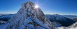 © Travel 'n' Lifestyle - View of a snow-dusted mountain peak piercing the clear blue sky, with sunlight creating a radiant starburst effect, Tri Kopy, Zilina Region, Slovakia.