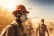 © nsit0108 - Construction workers wearing hard hats, goggles, and masks on a dusty industrial site