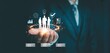 © Macrostock - Human resource and team management concept with businessman holding digital team icon, representing employee data system, workforce management, business connection, leadership and talent analytics.