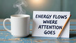 © Nusrat - White coffee mug with steam on blue wooden table next to motivational note and pencil