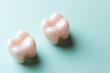 © nilawan - Pink Cartoon Teeth on Mint Green Background for Dental Health and Oral Hygiene Concepts
