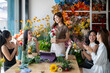 © Wasana - Women learning flower arranging skills in a creative workshop