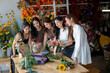 © Wasana - Women learning floristry, creating flower bouquets in workshop