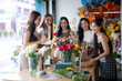 © Wasana - Asian women florists preparing flower bouquets in workshop