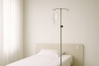 © MD - Hospital room bed with iv drip stand and fluid bag, medical infusion therapy equipment hospital.