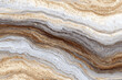 © Tohamina - abstract natural stone texture with earthy tones and wavy layered patterns