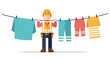 © vemas - Man in hard hat hanging colorful clothes on a laundry line outdoors