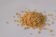 © Trending Now - Pine nuts, also known as pine kernels, presented in a loose pile, featuring shelled seeds on a clean surface. Close-up food image highlighting smooth texture, commonly used in Mediterranean cuisine