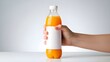 © stock by siam - Hand holding orange juice bottle.