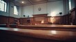 © The Little Hut - Empty courtroom interior featuring classic wood paneling and natural light, symbolizing justice and legal proceedings