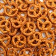 Many Pretzels Arranged on a Flat Surface Showing Their Twisted Shapes and Salty Surface