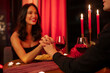 © Home-stock - Romantic date. Couple in love having dinner at restaurant, talking and holding hands, intimate moment. Valentine's day celebration