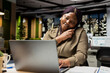 © DC Studio - General manager answering a phone call at the office late at night, opening laptop to read reports data and engage in a transparent dialogue. Exchanges ideas to strengthen relations.
