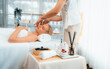 © InfiniteFlow - Caucasian woman enjoying relaxing anti-stress head massage and pampering facial beauty skin recreation leisure in dayspa modern light ambient at luxury resort or hotel spa salon. Quiescent