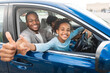 © Prostock-studio - Family Approving New Car. Happy African American Father And Daughter Gesturing Thumbs Up Sitting In Automobile, Smiling To Camera. Road Trip, Transportation. We Like Our Auto. Selective Focus