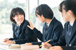 © buritora - Smiling classmates talking during class, elementary school, junior high school, and high school girls