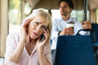 © Prostock-studio - Weak Cell Signal Concept. Upset mature woman talking on cellphone and plugging ear with finger sitting in public transport, confused senior lady can't hear because of noise and loud passengers
