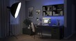 © noorma - Professional  lighting equipment illuminates a contemporary home office setup in a darkened room