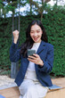 © crizzystudio - Young woman celebrating success looking at phone with excitement