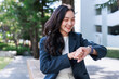 © crizzystudio - Young asian woman checking time on wearable technology