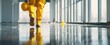 © Studio Nova - The construction worker in yellow protective suit walking on reflective wet floor