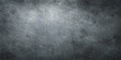 © Md - Aged dark grunge metal surface with a rough textured pattern and vintage gray concrete wall backdrop for a blank dirty design