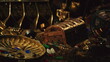 © icetray - A rich collection of gold coins and gemstones sprawls across a dark surface. Ancient artifacts and a treasure chest add to the mystique of this hidden trove.