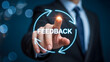 © Muhammad - Businessperson pointing at glowing feedback text with circular arrows symbolizing communication and continuous improvement