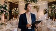 © ArtMajestic - Caucasian woman event planner with headset and clipboard supervising wedding reception in decorated hall. Professional organization and hospitality management banner with copy space