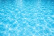 © AkuAku - Shimmering blue swimming pool surface with flowing wave textures and copy space