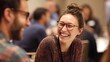 © Oleh - Young woman with glasses laughing wholeheartedly enjoying a lively conversation and expressing happiness and joy while engaging in a networking event or social gathering