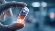 © vatcharapong - telemedicine global health. A hand holding a glowing capsule in a clinical setting, symbolizing innovation in medicine.