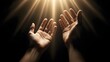 © Artfinity - Human hands reaching up toward divine glowing light beams. Hope and spirituality concept. Person stretching arms toward heaven in dark background with bright celestial rays