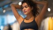 © Tania - A shopper adjusting activewear in a sporty high-tech fitting room featuring motion-friendly mirrors that reveal fit and flexibility from every angle. cinematic color correction, natural uneven