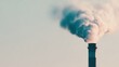 © red_orange_stock - Smoke rises from a factory chimney during daytime against a clear sky