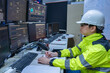 © reewungjunerr - Engineer working at control room in the factory,Manager control system at Industrial plant,Technician man monitoring program from a lot of monitor