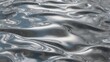 © Peni - Wavy molten silver metal surface abstract background.