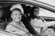 © Sabrina - African mother and daughter  smiling on camera inside a car - Driving licence, family lifestyle and transportation concept - Black and white editing