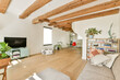 © ADDICTIVE STOCK - Bright and Modern Living Room with Rustic Beams