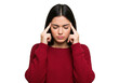 © Amin - Young woman with dark hair concentrating deeply touching her temples with fingers transparent background